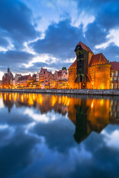 Old town of Gdansk with ancient crane at dusk
