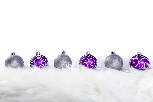 Purple and silver christmas baubles — Stock Photo, Image