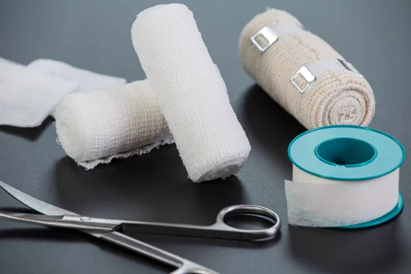 Medical bandages with scissors and sticking plaster — Stock Photo, Image