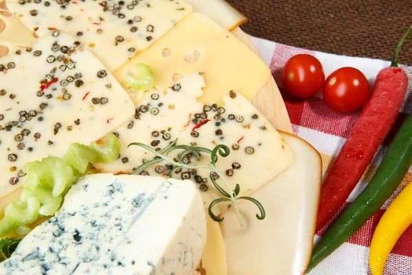 Variety of cheeses on a cutting board — Stock Photo, Image