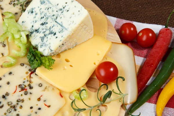 Variety of cheeses on a cutting board — Stock Photo, Image
