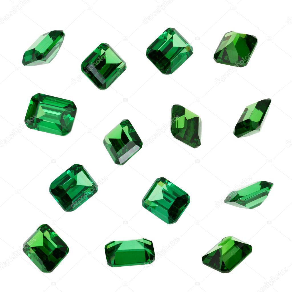 Green emerald gemstones isolated on white background.