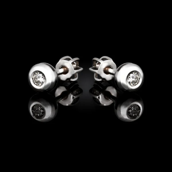 Earrings on black background — Stock Photo, Image