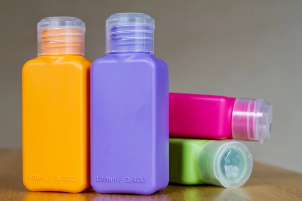 Small colored plastic bottles for traveling