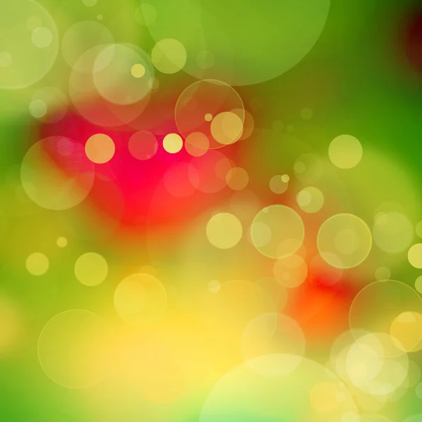 緑と赤でぼやけた円で抽象的な背景 — ストック写真