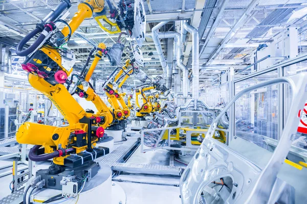 Robots in een autofabriek — Stockfoto