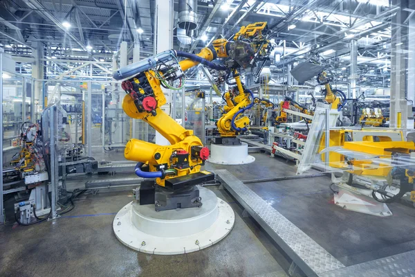 Robotar i en bilfabrik — Stockfoto