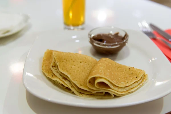Pancakes with chocolate  on  plate — Stock Photo, Image