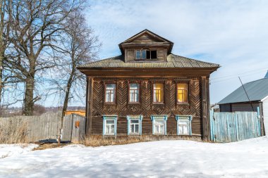 Old village house in countryside in Russia clipart