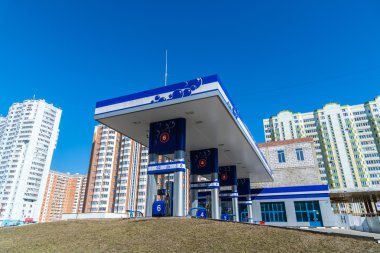 Balashikha, Russia - April 05.2016. gas station on  background of high-rise buildings