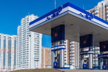 Balashikha, Russia - April 05.2016. gas station on  background of high-rise buildings
