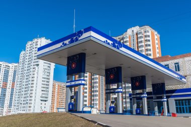 Balashikha, Russia - April 05.2016. gas station on  background of high-rise buildings