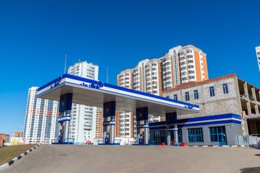 Balashikha, Russia - April 05.2016. gas station on  background of high-rise buildings