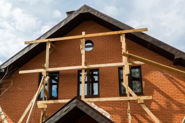 Unfinished private house from a red brick
