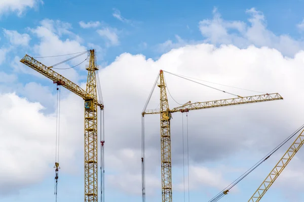 Two construction cranes on  blue sky background — Stock Photo, Image