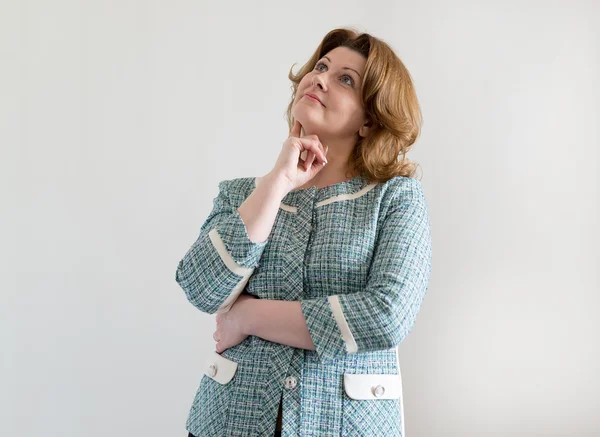 Woman in  green jacket looking up and  dreaming — Stock Photo, Image