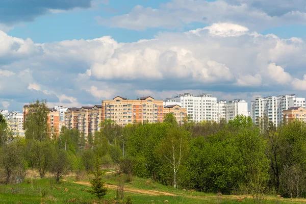 Natural summer landscape with the city in the distance — Stock Photo, Image