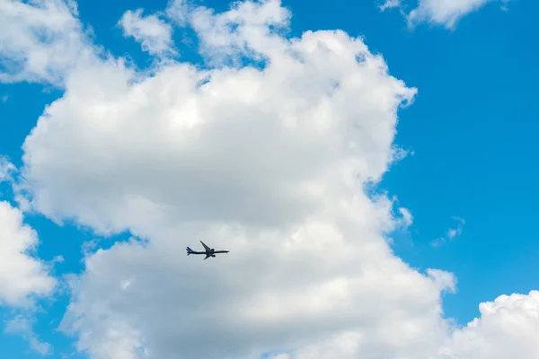 Blue sky  on summer day with small plane — Stock Photo, Image