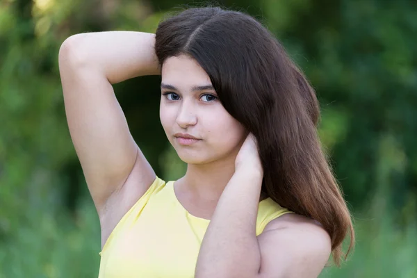 Teen girl with beautiful hair in nature alone — Stock Photo, Image