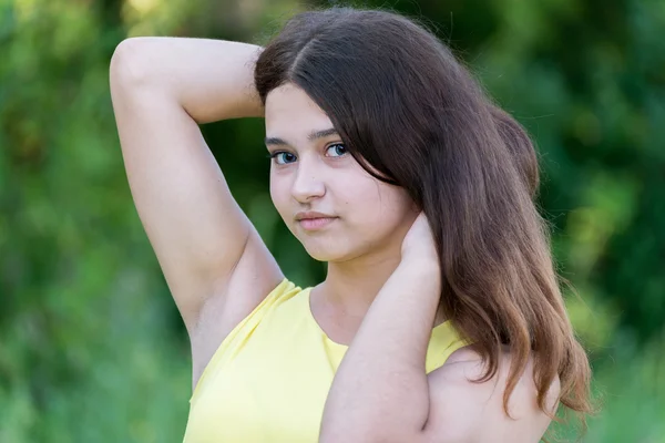 Teen girl with beautiful hair in nature alone — Stock Photo, Image