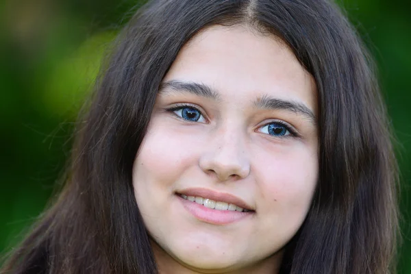 Portrait of teen brunette with blue lenses in eyes — Stock Photo, Image