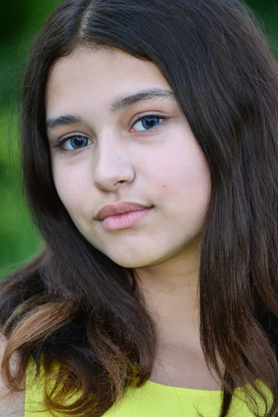 Portrait of teen brunette with blue lenses in eyes — Stock Photo, Image