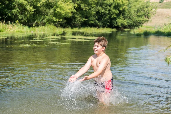 Full 10 years boy swim in  river — Stock Photo, Image