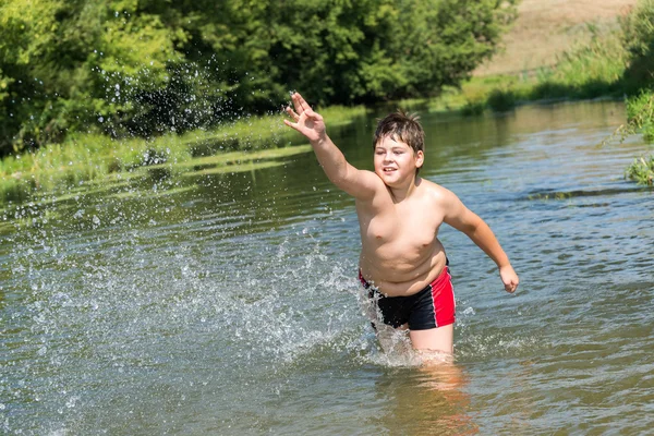 Full 10 years boy swim in  river — Stock Photo, Image