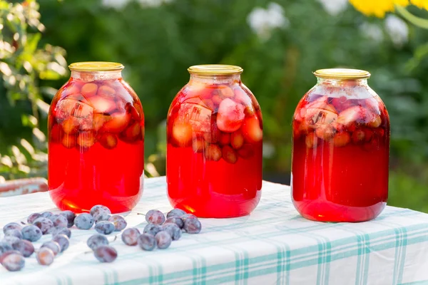 Plum compote home canning in the garden — Stock Photo, Image