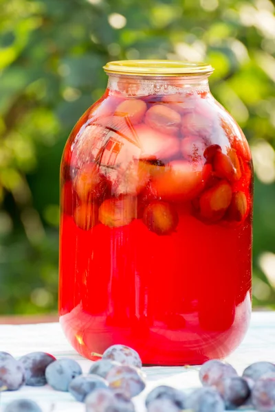 Plum compote home canning in the garden — Stock Photo, Image