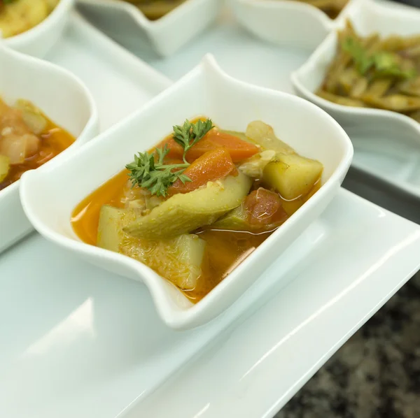 Marinated vegetables in portioned plates — Stock Photo, Image