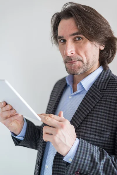 Man with the tablet in his hands — Stock Photo, Image