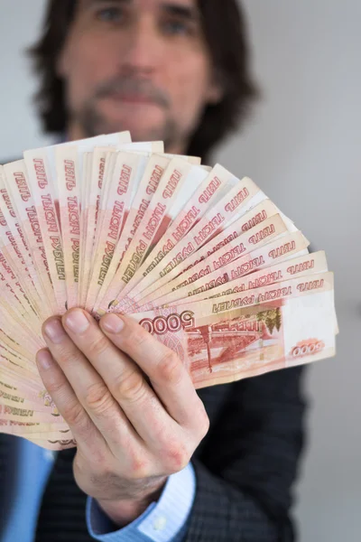 Man with Russian money in hands — Stock Photo, Image