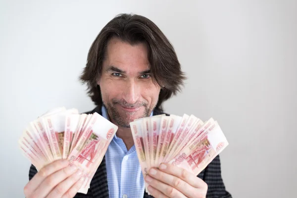 Man with Russian money in hands — Stock Photo, Image