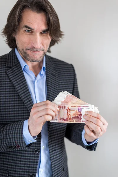 Man with Russian money in hands — Stock Photo, Image