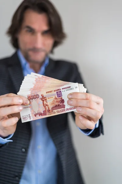 Man with Russian money in hands — Stock Photo, Image