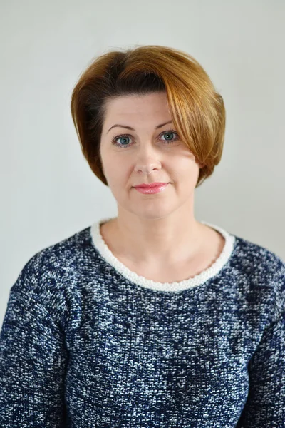 Portrait of the adult female on  light background — Stock Photo, Image