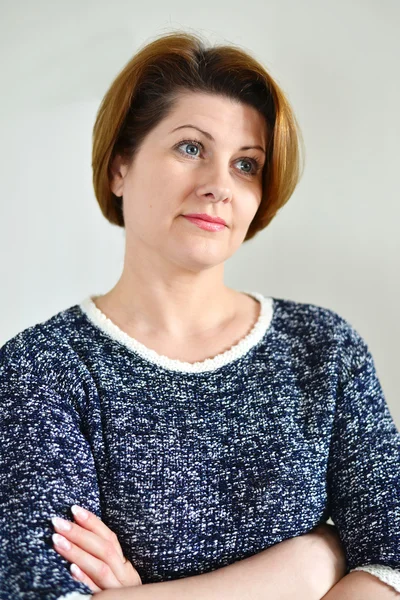 Portrait of the adult female on  light background — Stock Photo, Image