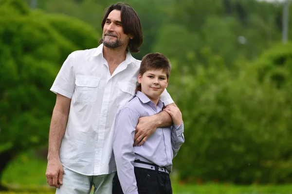 Father and son in summer park — Stock Photo, Image