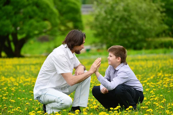 Father and son in summer park — Stock Photo, Image