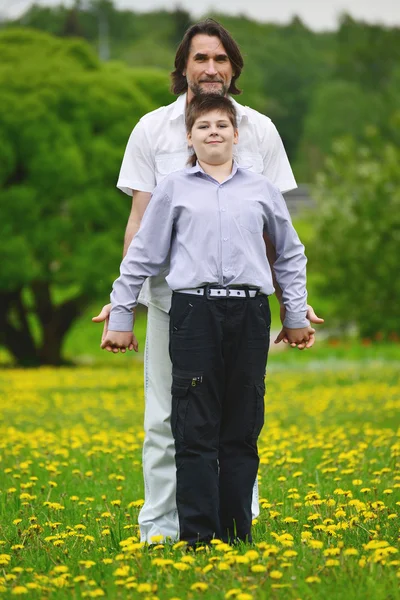 Father and son in summer park — Stock Photo, Image