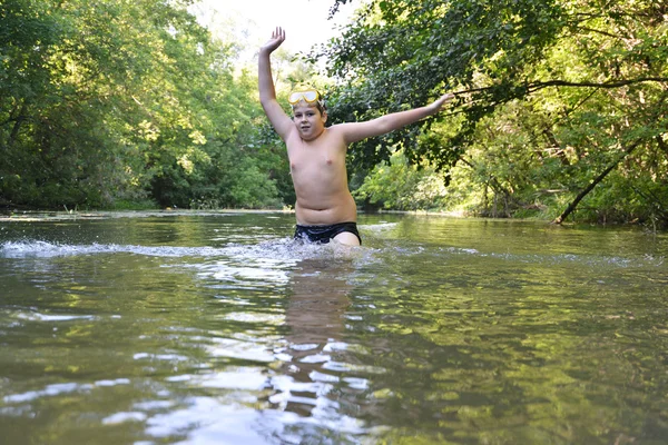 Boy teenager swims in  river in summer — Stock Photo, Image