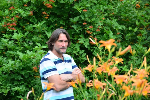 Dark-haired man with a beard in nature — Stock Photo, Image