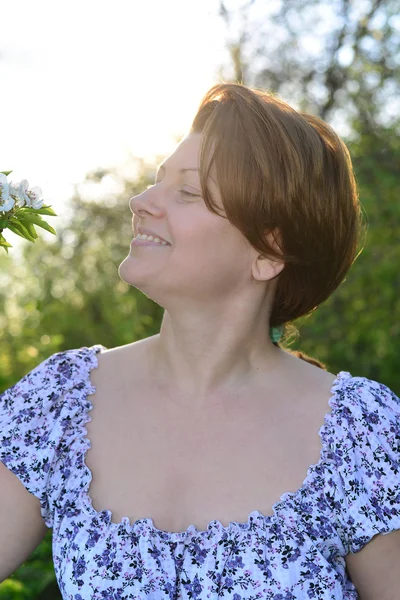 Awoman in  apple orchard at  early spring — 스톡 사진