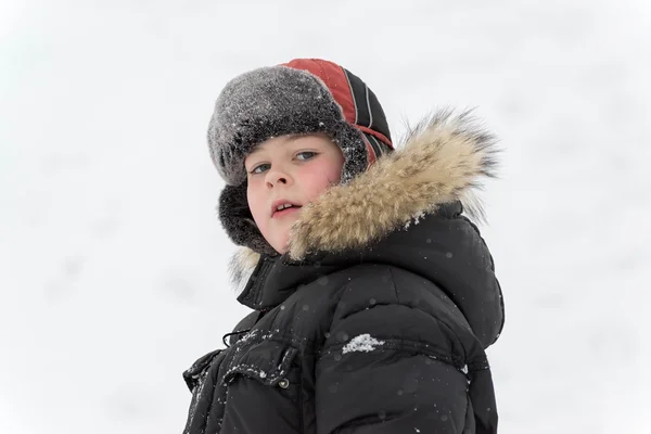 Teenage boy playing snow in winter — Stock Photo, Image