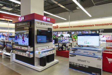 Khimki, Russia - December 22 2015. TV in Mvideo large chain stores selling electronics and household appliances clipart