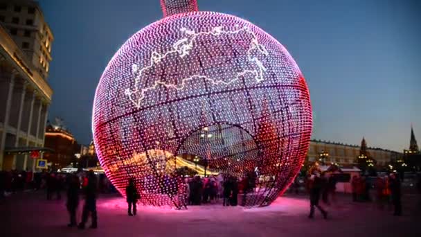 Moscow, Russia - January 15, 2015. illuminated Christmas ball on Manezh Square — Stock Video