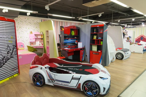 Khimki, Russia - February 13. 2016. Children's bed in  form of auto in Grand Furniture shopping, largest specialty shop.