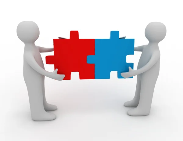 Two person matching puzzle pieces — Stock Photo, Image