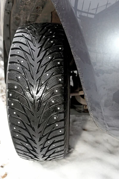 Car tire in the winter way — Stock Photo, Image